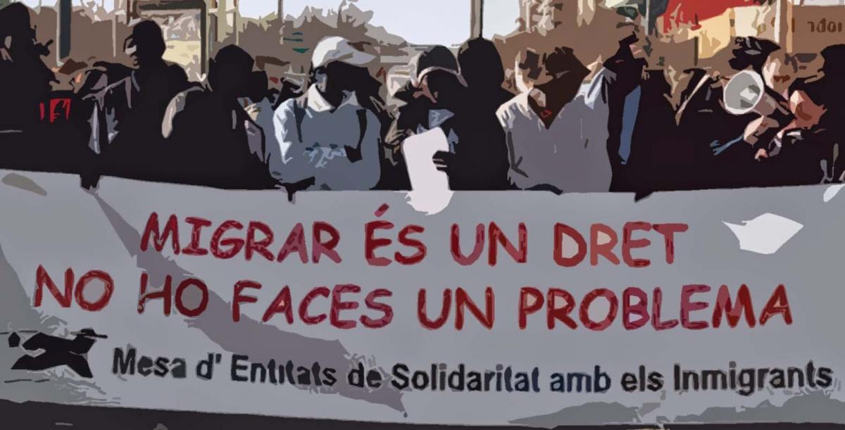 Pancarta de la Mesa de solidaritat amb les persones migrants